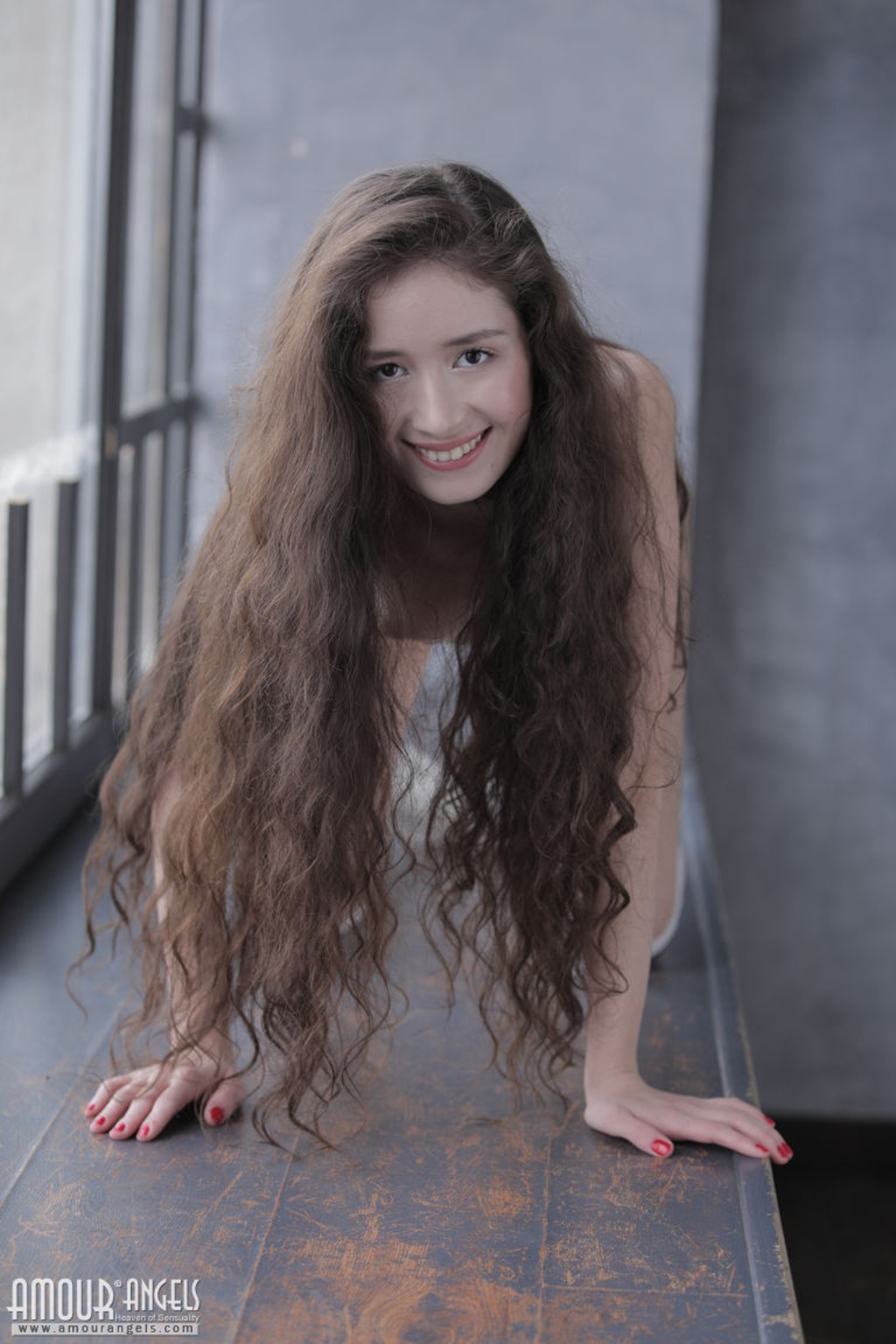 Curly brunette posing 12